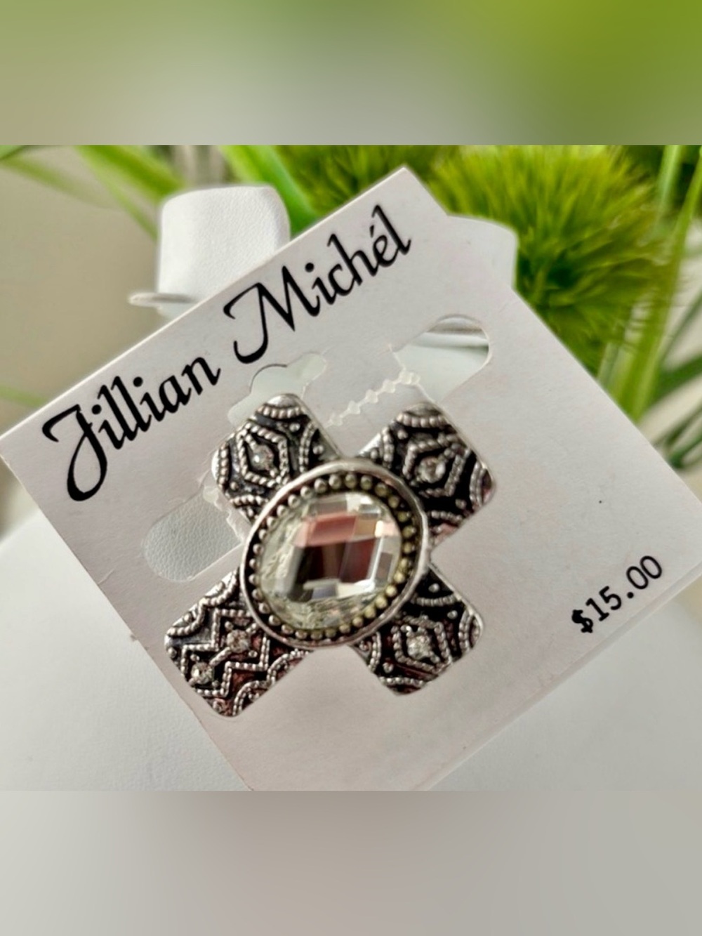Jillian Michel Cross,silvertone w/clear oval beveled stone, black wash, stretch